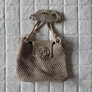 Crochet bag with rope handles and flower detail